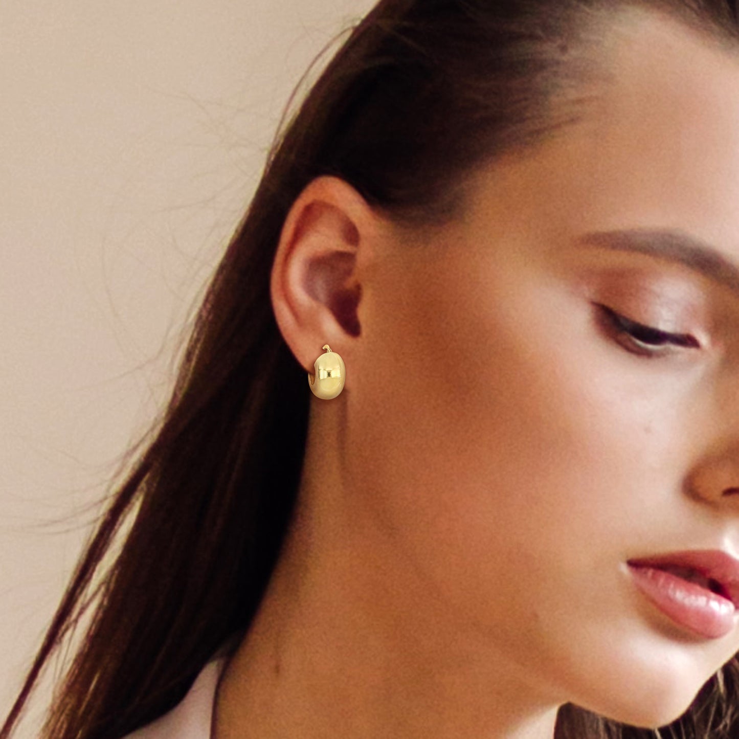 18MM Wide huggie polished earrings in yellow plated sterling silver