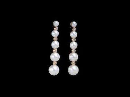 Cultured freshwater pearl and 1/4ct tgw white topaz graduated dangle earrings in yellow plated sterling silver