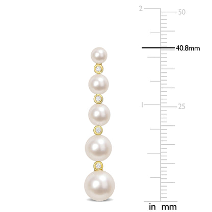 Cultured freshwater pearl and 1/4ct tgw white topaz graduated dangle earrings in yellow plated sterling silver